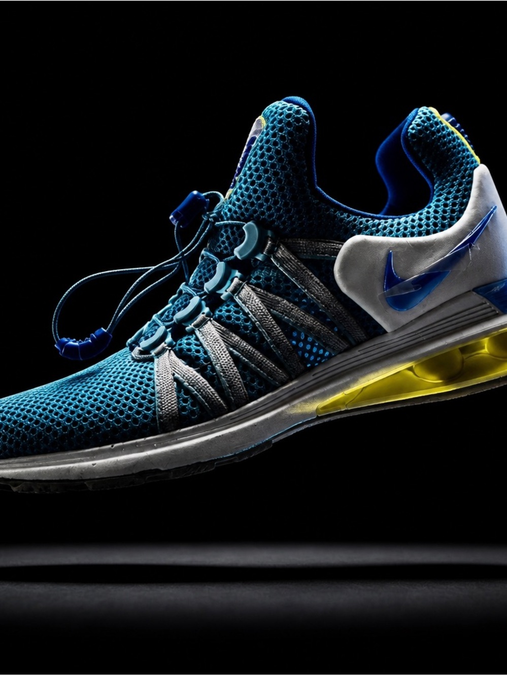 Nike Men’s Teal Mesh Trainer with Yellow Midsole Accent